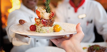 Enjoying the best cruise ship food with a private dinner at the Chef's table. 