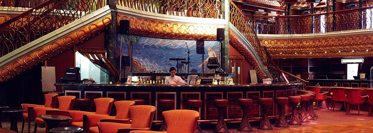 The Atrium Bar has live music and a welcoming vibe onboard a Carnival Cruise.