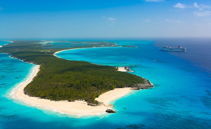 aerial view of half moon cay with a carnival cruise ship sailing at sea