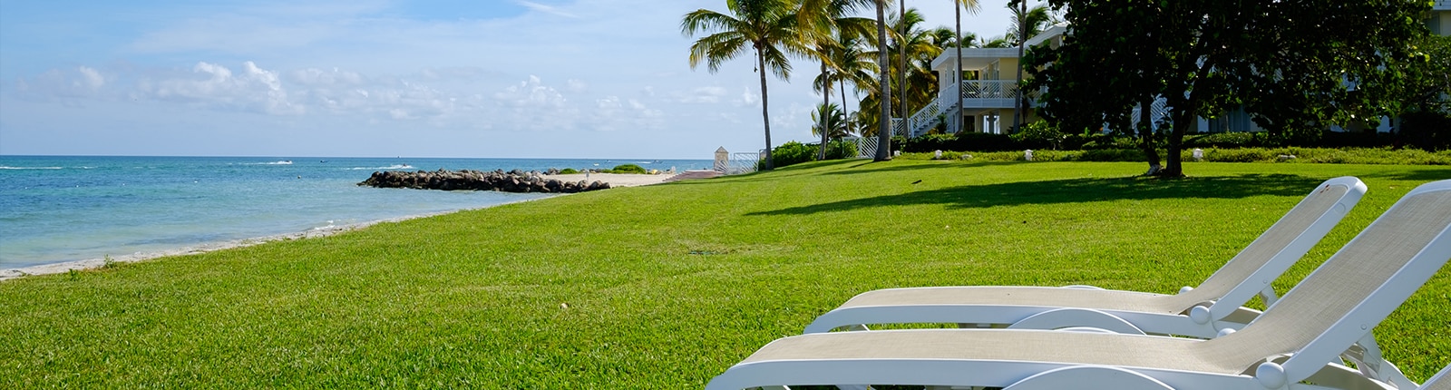 Two beach chairs overlooking the coast of Freeport, Bahamas