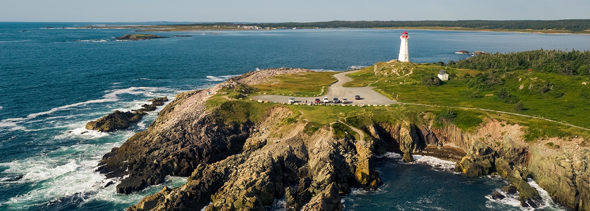 view of the lighthouse and cliffs in sydney, nova scotia