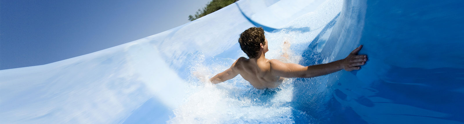 Sliding down the waterslide on De Palm Island in Aruba