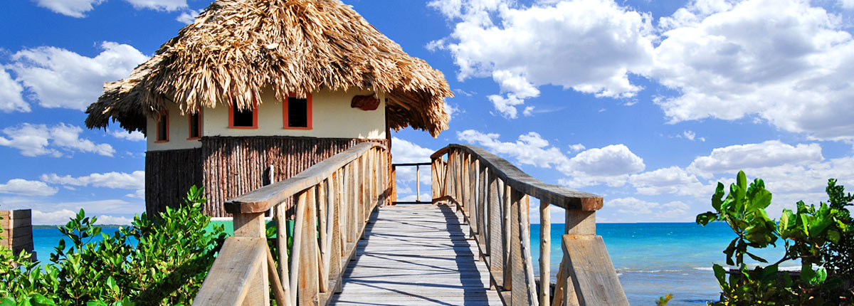 tiki hut in belize overlooking ocean