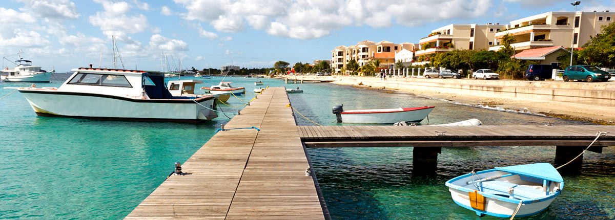 boats docked on the coast of bonaire