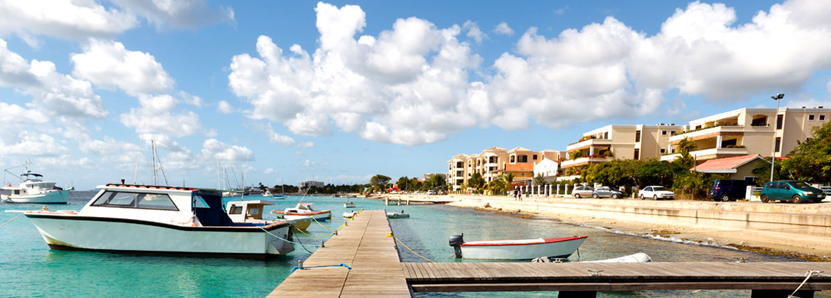 boats docked on the coast of bonaire