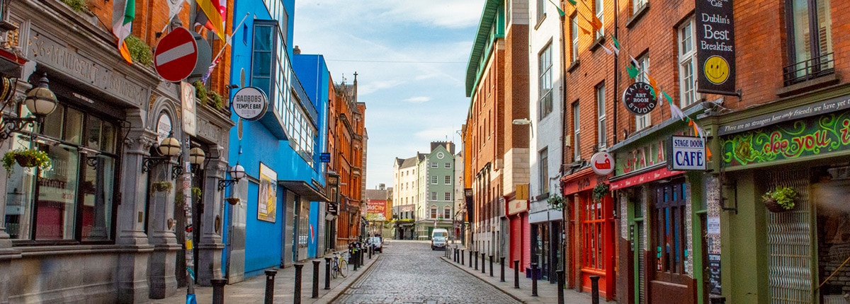 the colorful pubs and restaurants along a road in dublin, ireland