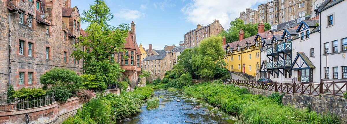 colorful houses along a canal in edinburgh, scotland