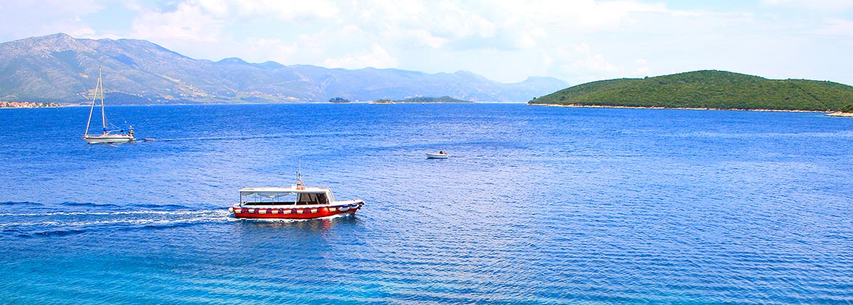 ships sailing through a bay