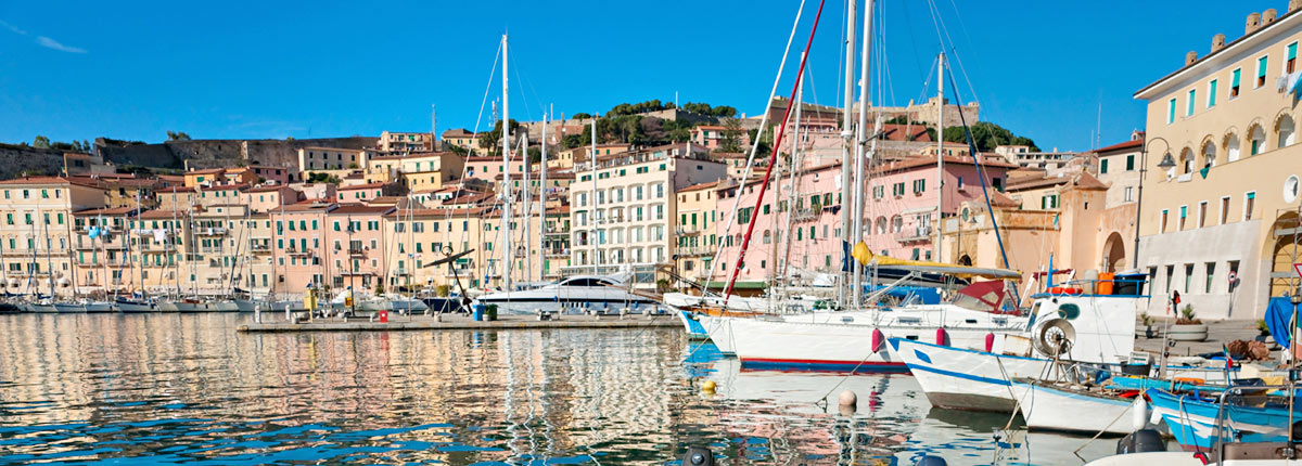 boats tied to dock in livorno