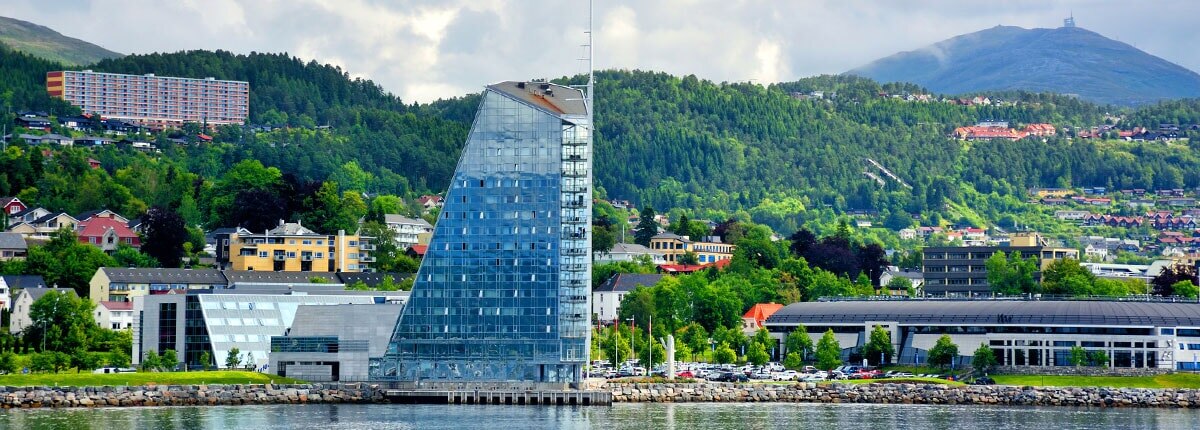 view of the city of molde and mountains in the background 