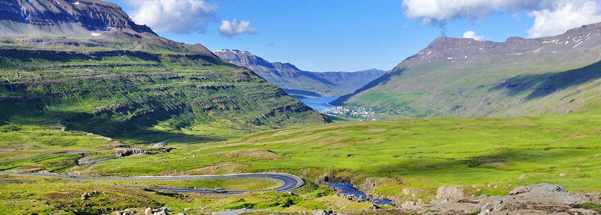 view of seydisfjordur from top of the mountain pass in iceland