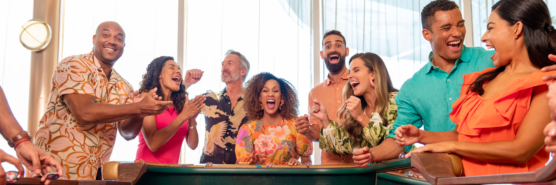 guests having fun playing craps in the casino onboard a carnival cruise