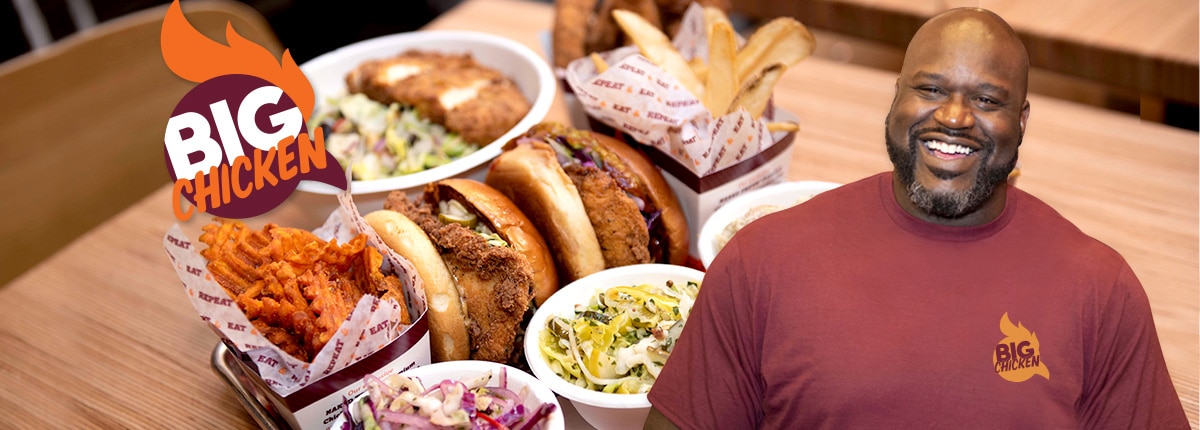 shaq’s big chicken restaurant filled with over-sized chicken sandwiches, fries and side dishes