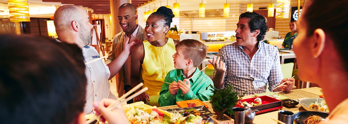 a group of guests gather around to enjoy a meal at bonsai sushi