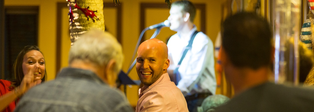 guests watching a singer at redfrog pub & brewery