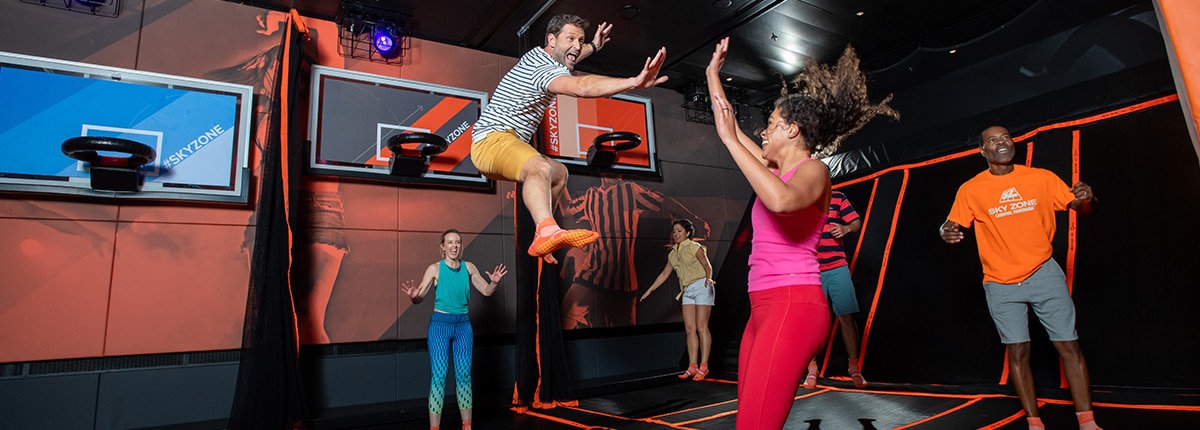 guests having fun jumping in skyzone onboard a carnival cruise ship