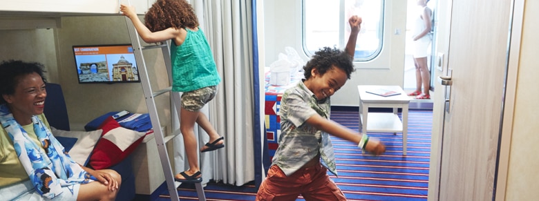 kids spends time playing inside the family harbor aft view balcony stateroom