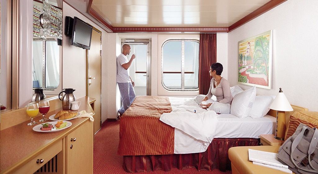 couple enjoying the stateroom on carnival cruise line