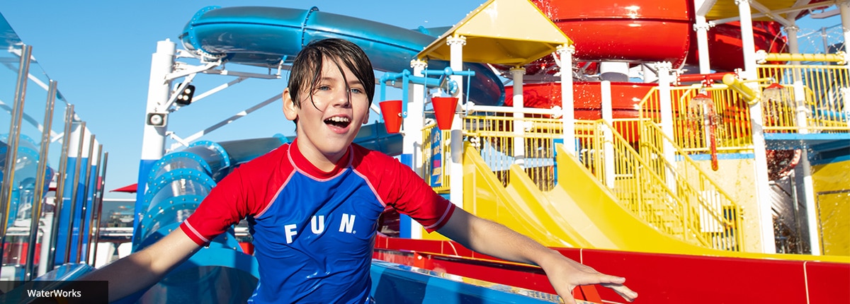 boy going down the waterslide on carnival panorama