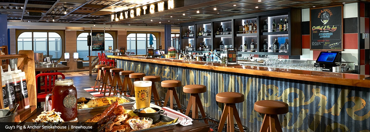 view of the bar and seating area inside guys pig and anchor smokehouse brewhouse on carnival panorama